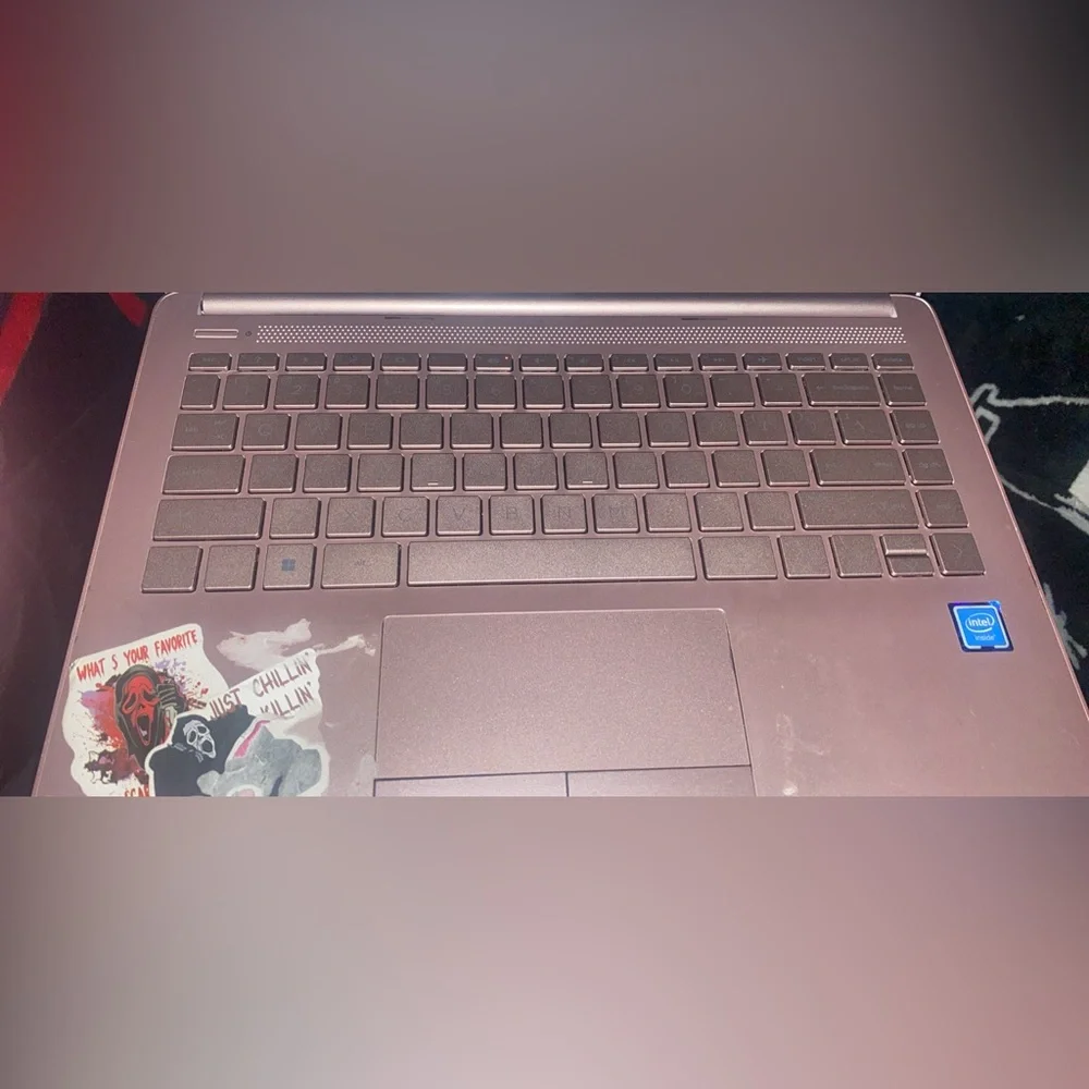 HP Pink Laptop with Assorted Sticker-Covered Lid